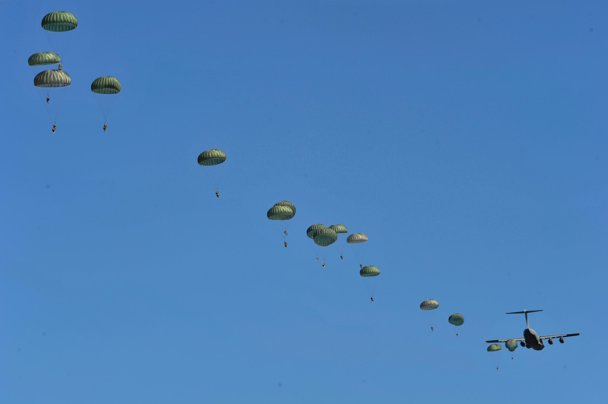 A U.S. Air Force C-130J Hercules aircraft drops Soldiers during Joint Operational Access Exercise (JOAX) 13-02 over Camp Mackall, N.C., Feb. 24, 2013. A JOAX is designed to enhance service cohesiveness between Army and Air Force personnel, allowing both services an opportunity to properly execute large-scale heavy equipment and troop movement. (U.S. Air Force photo by Airman 1st Class Jasmonet Jackson/Released)
