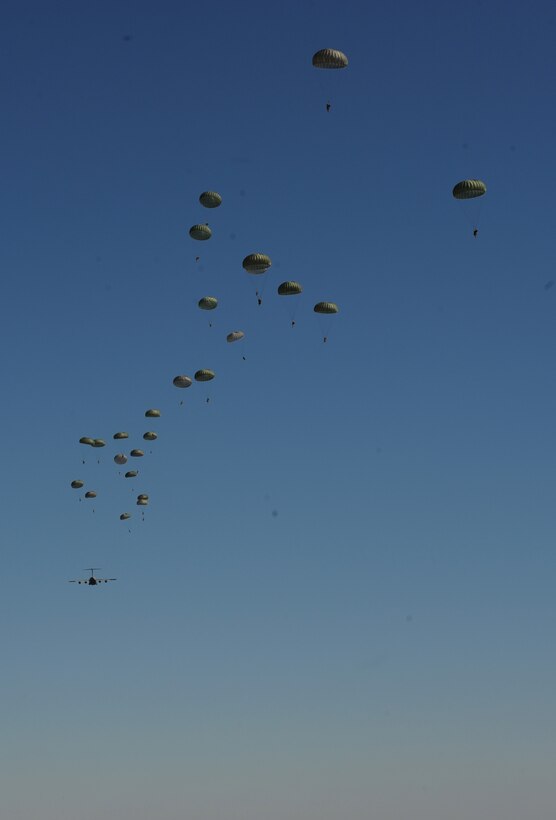 A U.S. Air Force C-130J Hercules aircraft drops Soldiers during Joint Operational Access Exercise (JOAX) 13-02 at Camp Mackall, N.C., Feb. 24, 2013. A JOAX is designed to enhance service cohesiveness between Army and Air Force personnel, allowing both services an opportunity to properly execute large-scale heavy equipment and troop movement. (U.S. Air Force photo by Airman 1st Class Jasmonet Jackson/Released)
