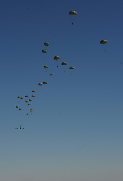 A U.S. Air Force C-130J Hercules aircraft drops Soldiers during Joint Operational Access Exercise (JOAX) 13-02 at Camp Mackall, N.C., Feb. 24, 2013. A JOAX is designed to enhance service cohesiveness between Army and Air Force personnel, allowing both services an opportunity to properly execute large-scale heavy equipment and troop movement. (U.S. Air Force photo by Airman 1st Class Jasmonet Jackson/Released)
