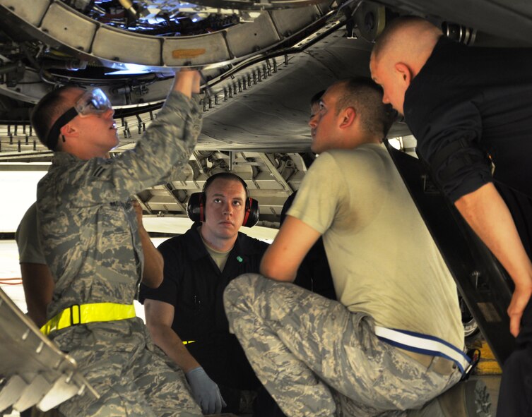 Airmen, from the 43rd Aircraft Maintenance Unit, perform maintenance on an F-22 Raptor (U.S. Air Force photo by Staff Sgt. Rachelle Elsea)