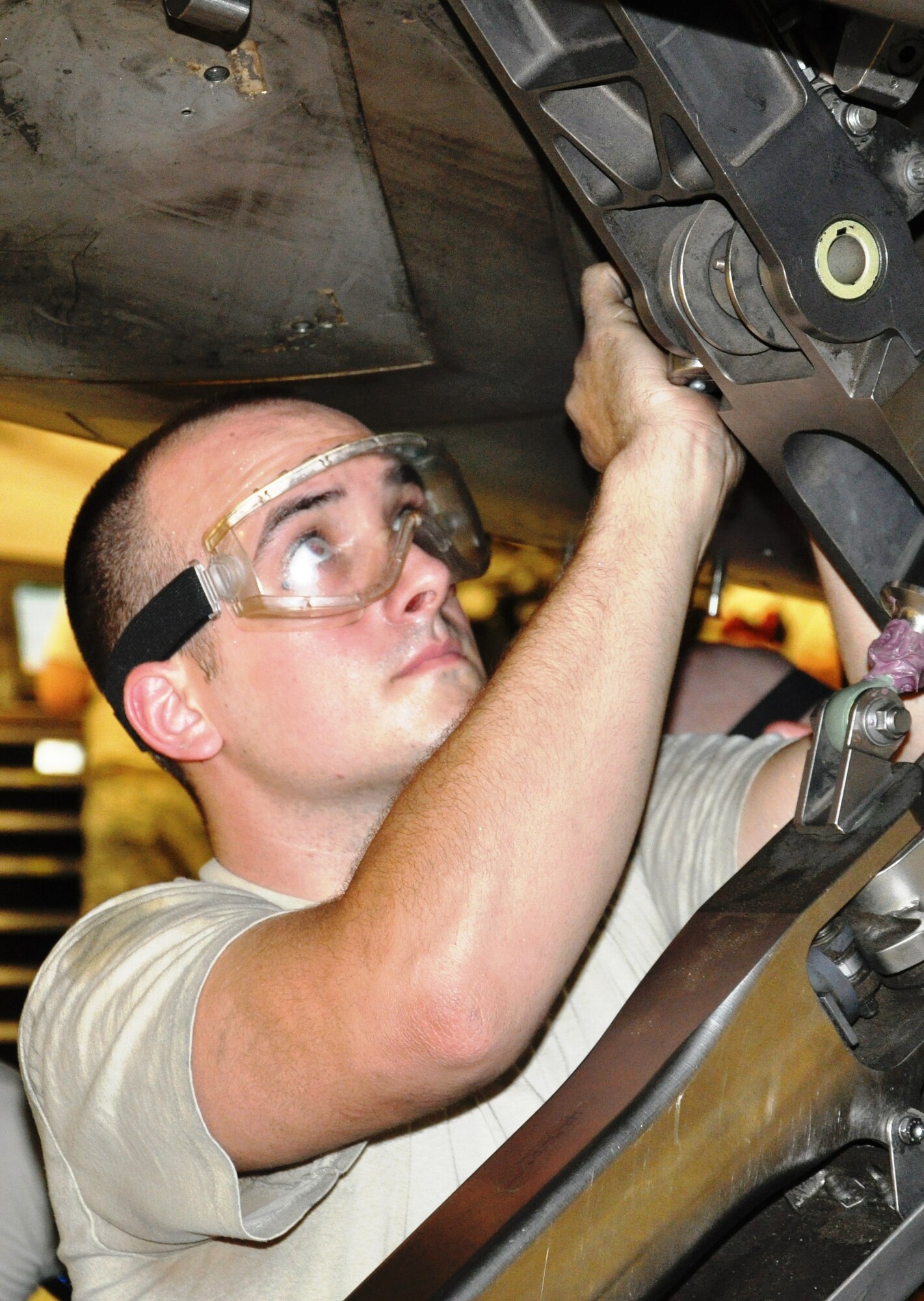 Senior Airman Michael Marquart, 43rd Aircraft Maintenance Unit assistant dedicated crew chief, performs maintenance on an F-22 Raptor (U.S. Air Force photo by Staff Sgt. Rachelle Elsea)