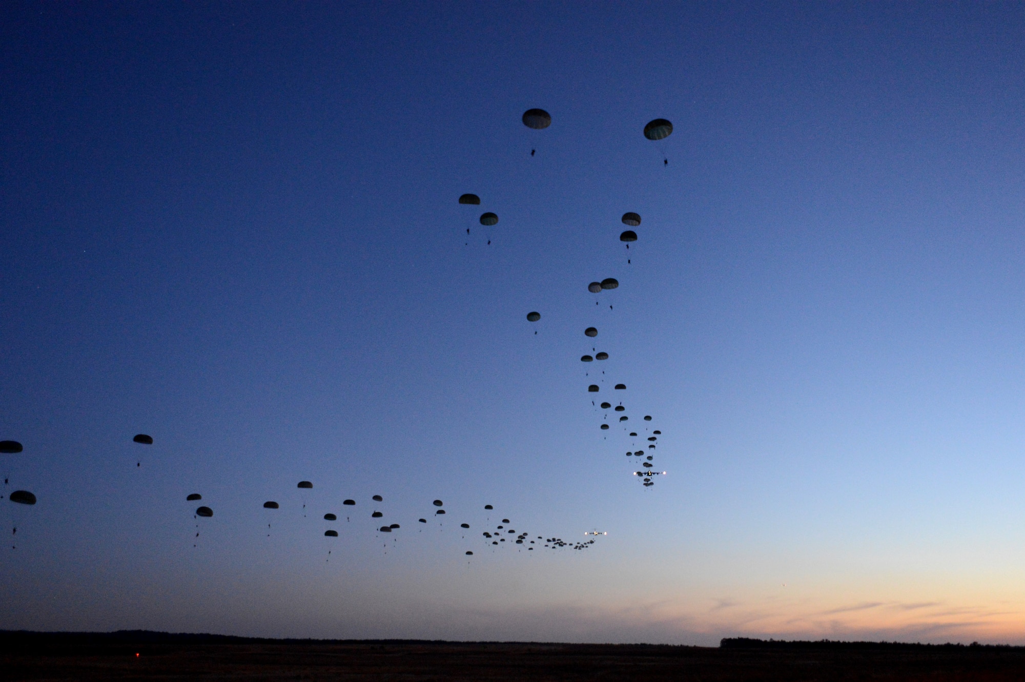 U.S. Soldiers with the 1st Battalion, 508th Parachute Infantry Regiment, 4th Brigade Combat Team, 82nd Airborne Division conduct a static line airdrop from U.S. Air Force C-17 Globemaster III aircraft during Joint Operational Access Exercise (JOAX) 13-02, Feb. 24, 2013, at Sicily drop zone, Fort Bragg, N.C. JOAX 13-02 is a combined exercise which enables U.S. and Canadian mobility aircrews to train with paratroopers from the U.S. Army's 82nd Airborne Division on projecting combat power in a denied environment. (DoD photo by Tech. Sgt. Jason Robertson, U.S. Air Force/Released) 
