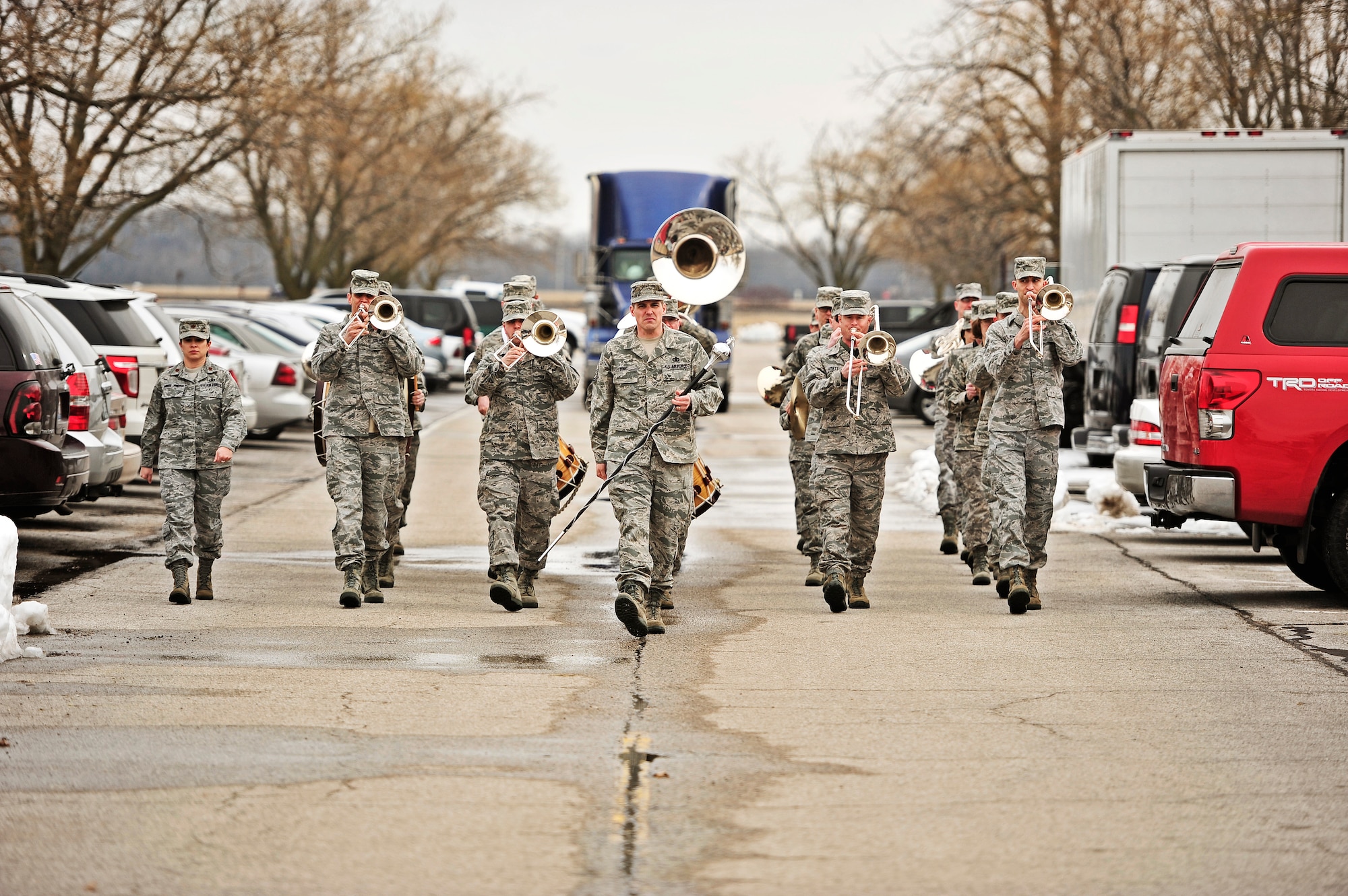 The United States Air Force Band of Mid-America marches outside as Marine Corps veteran Robert Geggie guest of honor and family arrive to the band hall on Scott Air Force Base, Ill. (U.S. Air Force photo/Staff Sgt. Ryan Crane)