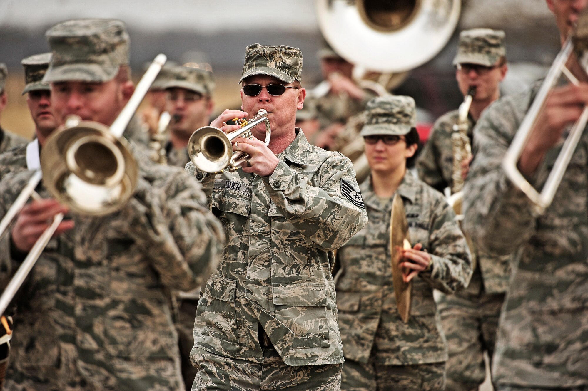 The United States Air Force Band of Mid-America marches outside as Marine Corps veteran Robert Geggie guest of honor and family arrive to the band hall on Scott Air Force Base, Ill. (U.S. Air Force photo/Staff Sgt. Ryan Crane)
