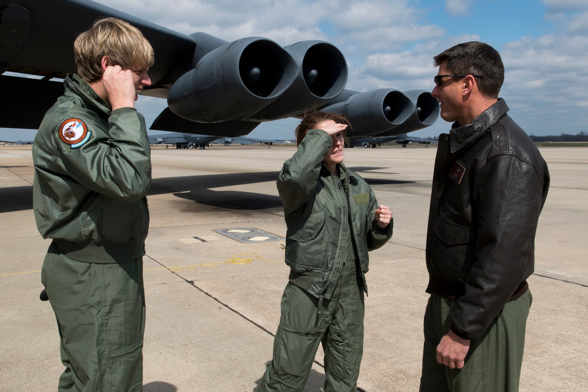 Joel Rodgers and Leslie Draffin talk with U.S. Air Force Lt. Col. John Booker, 93rd Bomb Squadron pilot, after their flight on a B-52H Stratofortress, Feb. 26, 2013, Barksdale Air Force Base, La. Rodgers and Draffin are reporters for KTAL Channel 6 News and are reporting on the mission of the 93rd Bomb Squadron, which is assigned to the 307th Bomb Wing at Barksdale. (U.S. Air Force photo by Master Sgt. Greg Steele/Released)