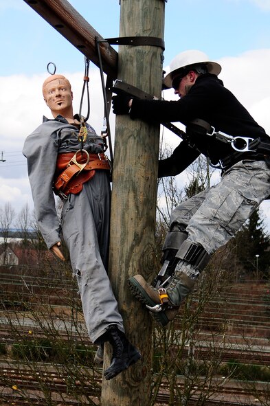 Airman 1st Class Richard Chandlee, 786th Civil Engineer Squadron electrical journeyman, rescues a simulated victim during a readiness exercise, Feb. 21, 2013, Ramstein Air Base, Germany. Readiness exercises are designed to educate and train Airmen on the skills needed for real-world responses. (U.S. Air Force photo/Airman 1st Class Hailey Haux)
