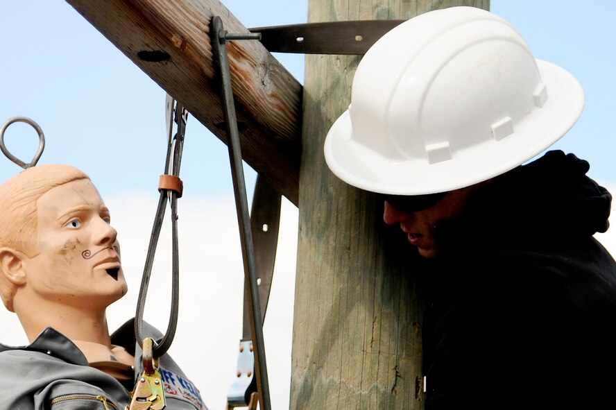 Airman 1st Class Richard Chandlee, 786th Civil Engineer Squadron electrical journeyman, rescues a simulated victim during a readiness exercise, Feb. 21, 2013, Ramstein Air Base, Germany. Readiness exercises are designed to educate and train Airmen on the skills needed for real-world responses. (U.S. Air Force photo/Airman 1st Class Hailey Haux)