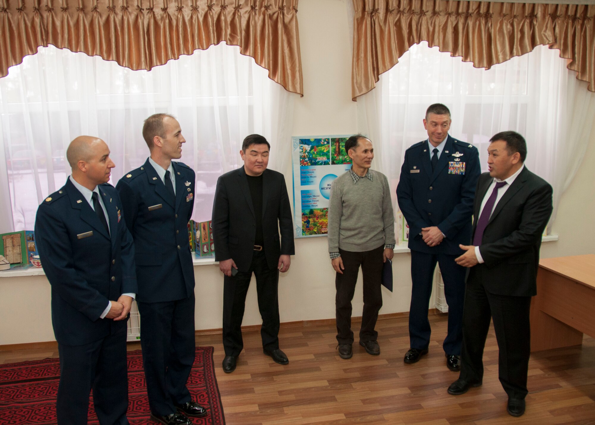 Right, Sakkaraey Mars Namurbekovich, head of Alanudun Regional Governmental Administration, and leadership from the Transit Center at Manas tour a classroom at the Vasilievskoe Kindergarten School in Vasilievskoe, Kyrgyzstan, Feb. 26, 2013. The Transit Center at Manas and the U.S. Embassy in Bishkek partnered with the Kyrgyz Republic government on a humanitarian assistance project to renovate the school building with new windows, floors and lighting in each classroom. (U.S. Air Force photo/Tech. Sgt. Rachel Martinez)