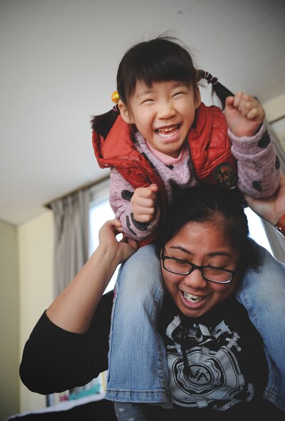 Senior Airman Marilou Leyble, vehicle management and analysis technician from the 51st Logistics Readiness Squadron, spends time with children from the Aehyang Orphanage in Pyongtak-si, Republic of Korea, Feb. 23, 2013. With the help of the Osan’s Chapel, more than 30 volunteers from Osan Air Base visited the orphanage to spend time with the children and try to give back to the community. (U.S. Air Force photo/Staff Sgt. Sara Csurilla)