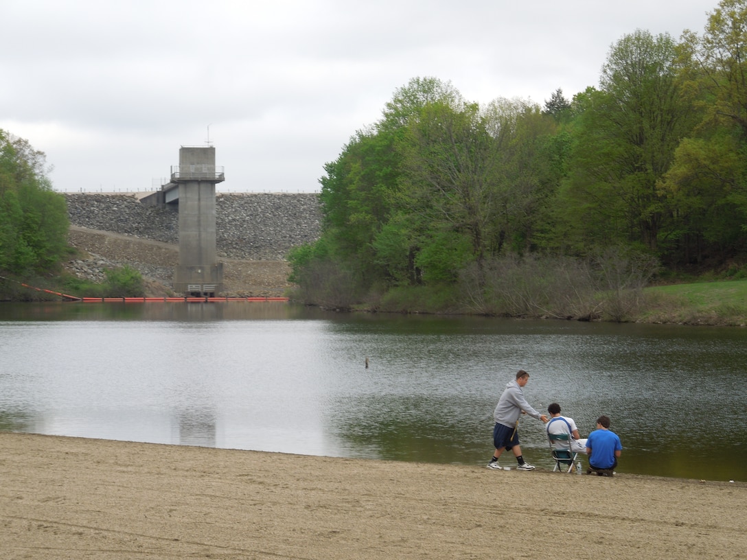 Visitors of Hop Brook Lake take advantage of the lake's beach and swimming areas, as well as the opportunity to fish over the Memorial Day weekend. The lake and dam are located in the towns of Naugatuck, Waterbury, and Middlebury, Conn. The recreation area is open from mid-April through mid-October, from 08:00 a.m. to sunset.