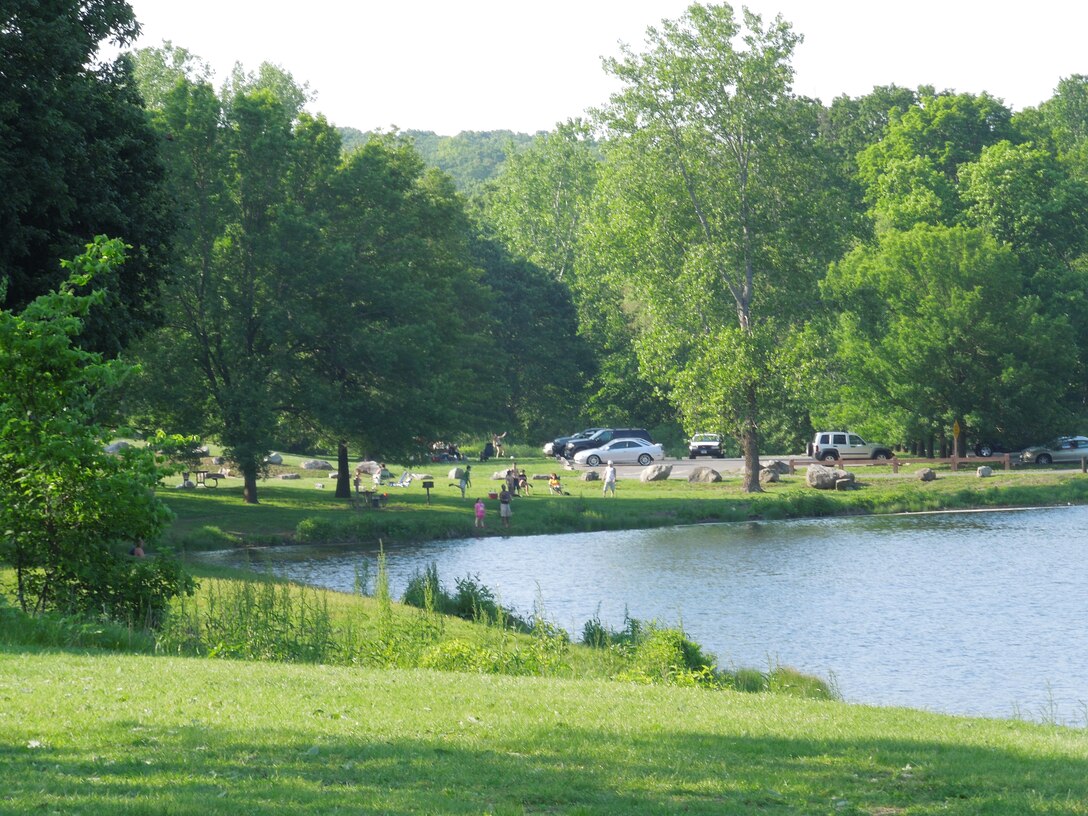 Visitors of Hop Brook Lake take advantage of the lake's beach and swimming areas, as well as the opportunity to fish over the Memorial Day weekend. The lake and dam are located in the towns of Naugatuck, Waterbury, and Middlebury, Conn. The recreation area is open from mid-April through mid-October, from 08:00 a.m. to sunset.