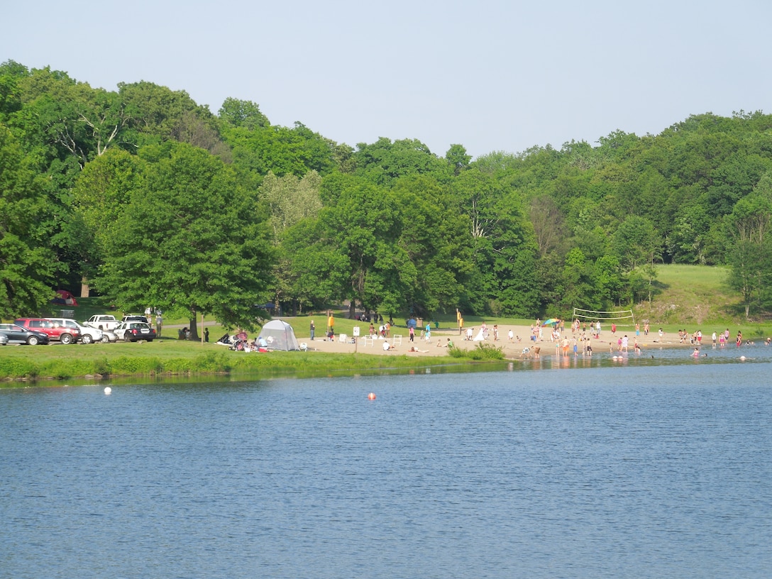 Visitors of Hop Brook Lake take advantage of the lake's beach and swimming areas, as well as the opportunity to fish over the Memorial Day weekend. The lake and dam are located in the towns of Naugatuck, Waterbury, and Middlebury, Conn. The recreation area is open from mid-April through mid-October, from 08:00 a.m. to sunset.