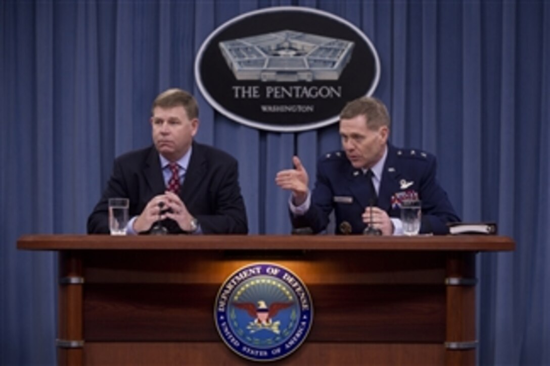 DoD Deputy Chief Information Officer for Command, Control, Communications and Computers and Information Infrastructure Maj. Gen. Robert Wheeler, right, and Defense Information Systems Agency Mobility Program Manager John Hickey, left,  brief the Pentagon press corps on the department’s Commercial Mobile Device Implementation Plan in the Pentagon on Feb. 26, 2013.  