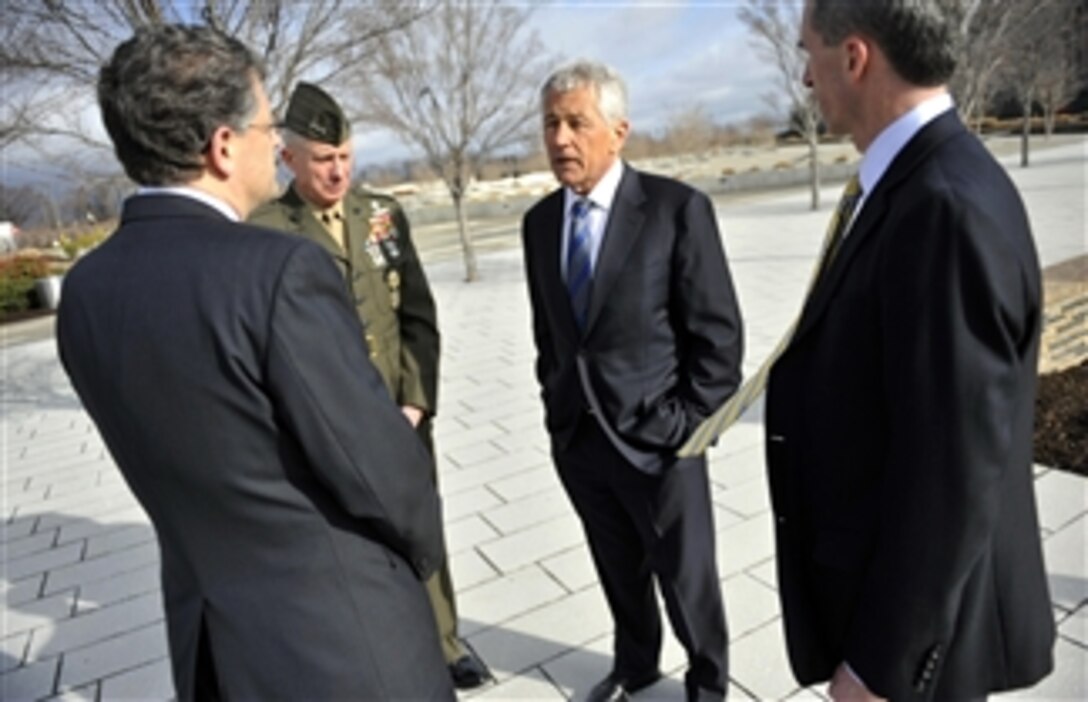 Secretary of Defense Chuck Hagel, center, is given a tour of the Pentagon 9-11 Memorial by DoD Director of Administration and Management Michael L. Rhodes, left, shortly after being sworn in as the 24th secretary of defense at the Pentagon on Feb. 27, 2013.  Hagel was accompanied by his Senior Military Assistant Lt. Gen. Thomas Waldhauser, U.S. Marine Corps, and Special Assistant to the Secretary of Defense Marcel J. Lettre.  