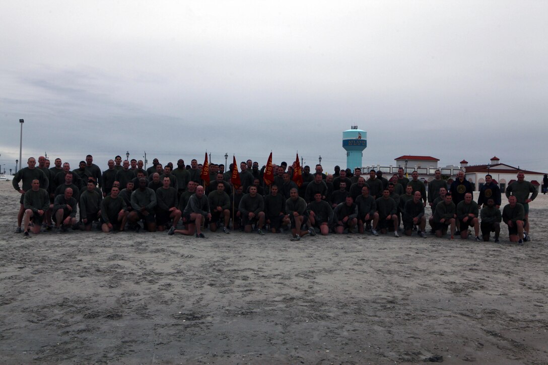 Instructors and staff with the Center for Naval Aviation Technical Training Marine Unit Cherry Point gather Feb. 22 at Atlantic Beach after a 3-mile run before plunging into the cold ocean water. The Marines participated in a polar bear plunge and earned a day off from their commanding officer.