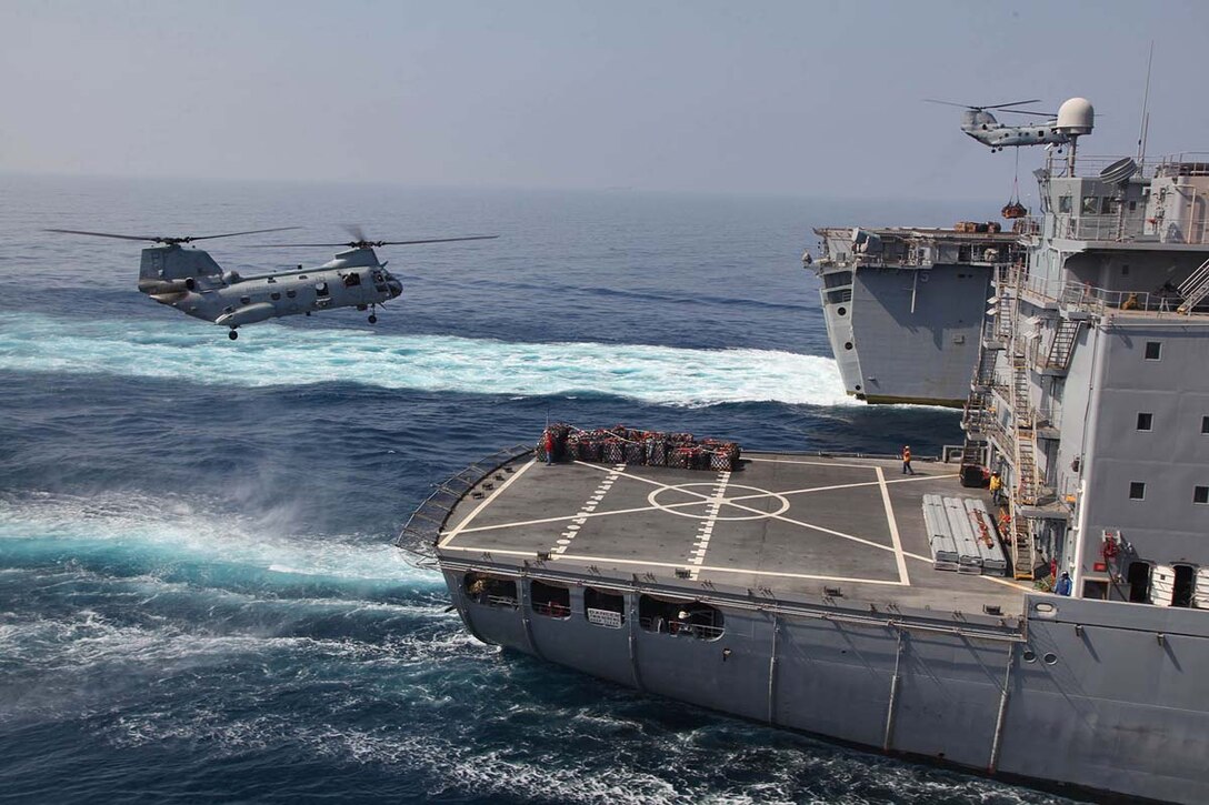 Two CH-46E Sea Knights assigned to Marine Medium Helicopter Squadron 364 (Rein.), 15th Marine Expeditionary Unit, conduct a vertical replenishment of the USS Peleliu from the USNS Patuxent, Feb. 20. The 15th MEU is deployed as part of the Peleliu Amphibious Ready Group as a U.S. Central Command theater reserve force, providing support for maritime security operations and theater security cooperation efforts in the U.S. 5th Fleet area of responsibility. (U.S. Marine Corps photo by Cpl. Timothy R. Childers/Released)