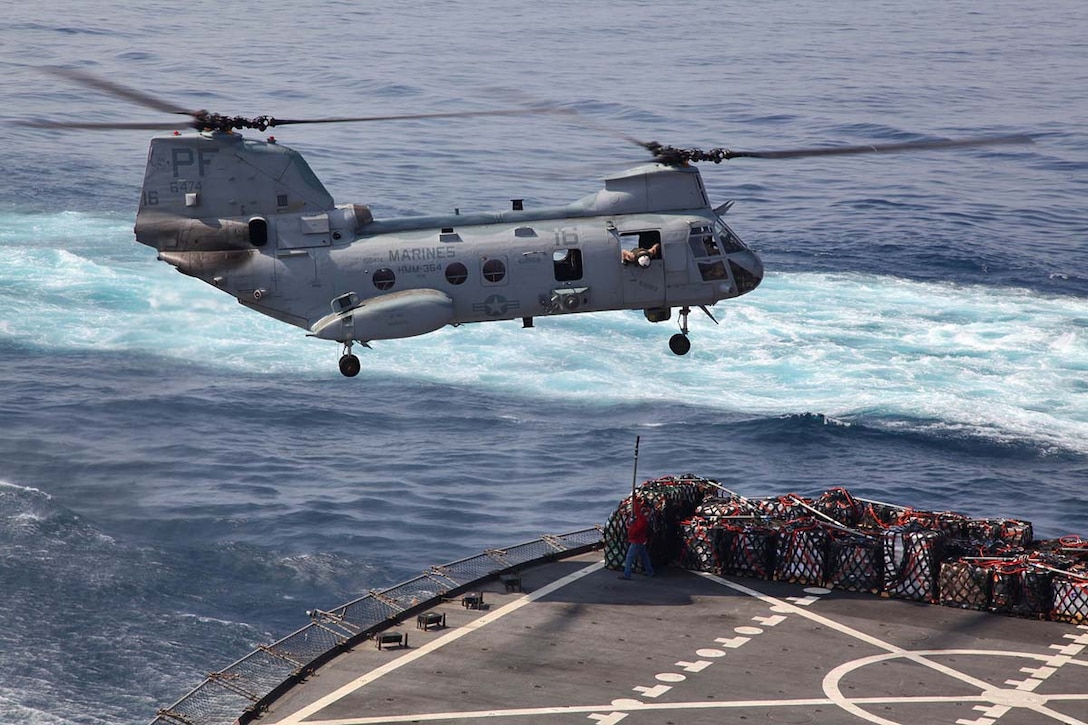 A CH-46E Sea Knight assigned to Marine Medium Helicopter Squadron 364 (Rein.), 15th Marine Expeditionary Unit, conducts a vertical replenishment from the USNS Patuxent to the USS Peleliu, Feb. 20. The 15th MEU is deployed as part of the Peleliu Amphibious Ready Group as a U.S. Central Command theater reserve force, providing support for maritime security operations and theater security cooperation efforts in the U.S. 5th Fleet area of responsibility. (U.S. Marine Corps photo by Cpl. Timothy R. Childers/Released)