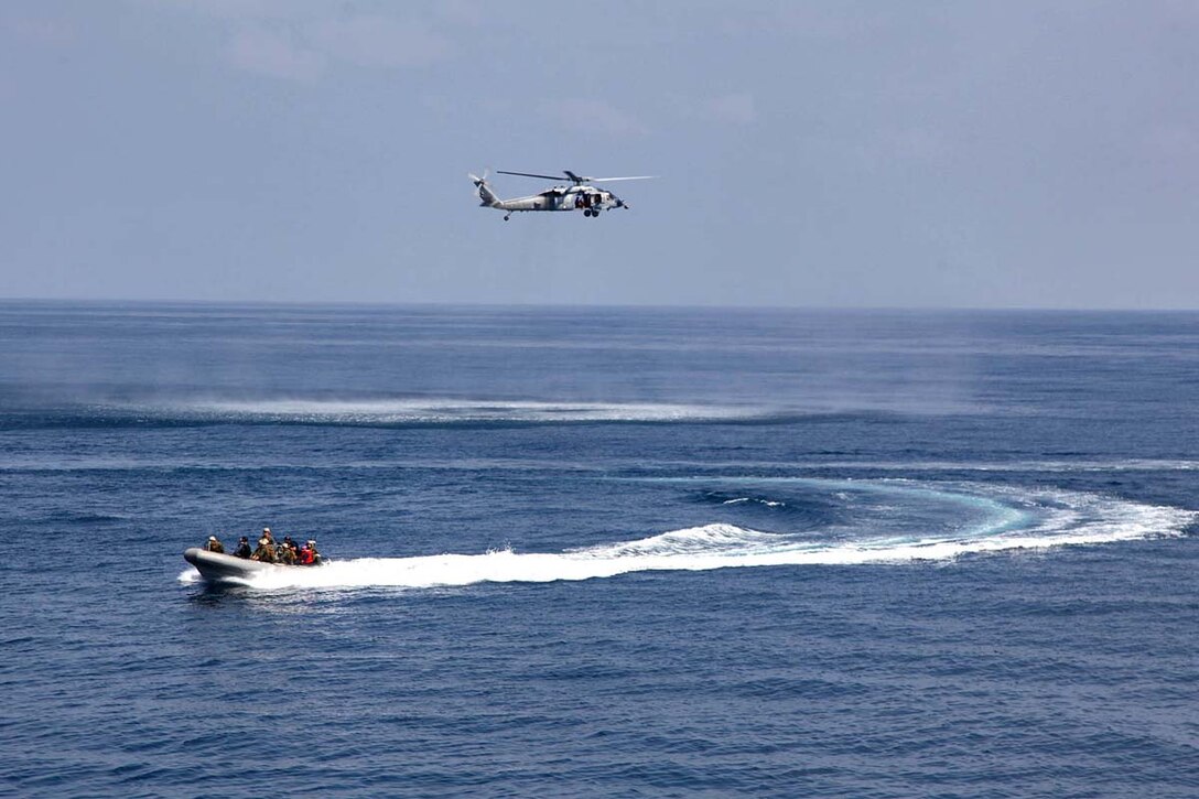Marines assigned to Maritime Raid Force, Command Element, 15th Marine Expeditionary Unit, conduct small-boat operations near the USS Rushmore, Feb. 21. The 15th MEU is deployed as part of the Peleliu Amphibious Ready Group as a U.S. Central Command theater reserve force, providing support for maritime security operations and theater security cooperation efforts in the U.S. 5th Fleet area of responsibility. (U.S. Marine Corps photo by Cpl. Timothy R. Childers/Released)