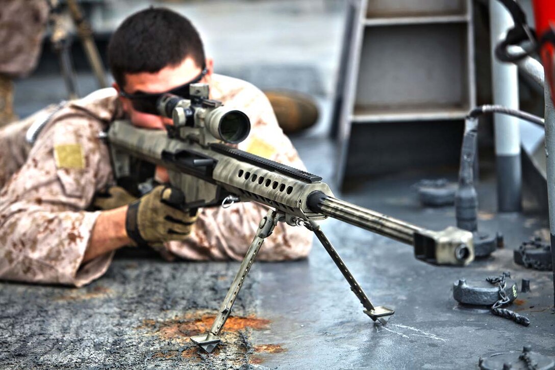 Corporal Diego Oropeza, scout sniper, Scout Sniper Platoon, Weapons Company, Battalion Landing Team 3/5, 15th Marine Expeditionary Unit, sights in on a target while conducting Maritime Interoperability Training aboard the USS Rushmore, Feb. 25. The 15th MEU is deployed as part of the Peleliu Amphibious Ready Group as a U.S. Central Command theater reserve force, providing support for maritime security operations and theater security cooperation efforts in the U.S. 5th Fleet area of responsibility. (U.S. Marine Corps photo by Cpl. Timothy R. Childers/Released)