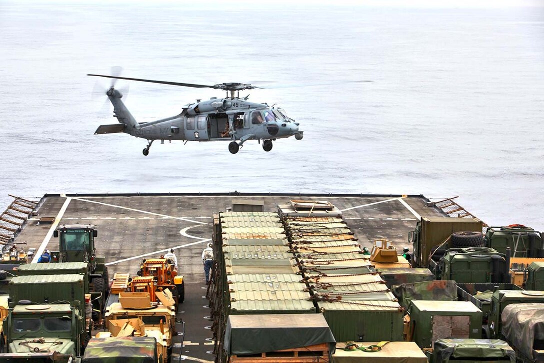 Marines assigned to Maritime Raid Force, Command Element, 15th Marine Expeditionary Unit,  and sailors assigned to the USS Rushmore conduct small-boat operations near the USS Rushmore, Feb. 25.  Servicemembers took advantage of their time at sea to conduct Maritime Interoperability Training that touched on a number of areas the Marines were unfamiliar with, including at-sea casualty evacuations, small boat proficiency and live-fire gunnery training. The 15th MEU is deployed as part of the Peleliu Amphibious Ready Group as a U.S. Central Command theater reserve force, providing support for maritime security operations and theater security cooperation efforts in the U.S. 5th Fleet area of responsibility. (U.S. Marine Corps photo by Cpl. Timothy R. Childers/Released)