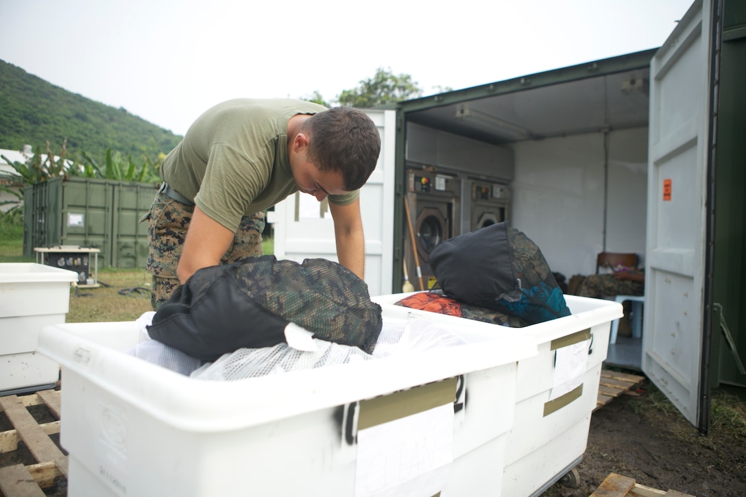 Lance Cpl. Rafael A. Cardona cleans laundry Feb. 22 for Marines and sailors in Sattahip, Chonburi province, Kingdom of Thailand, during exercise Cobra Gold 2013. Basic cleaning services provided during exercises and deployments reduce the spread of illness and enable successful training. Cardona is a basic water support technician with 9th Engineer Support Battalion, 3rd Marine Logistics Group, III Marine Expeditionary Force. CG 13, in its 32nd iteration, is the largest multinational exercise in the Asia-Pacific region and demonstrates commitment to building interoperability with participating nations and to supporting peace and stability in the region.