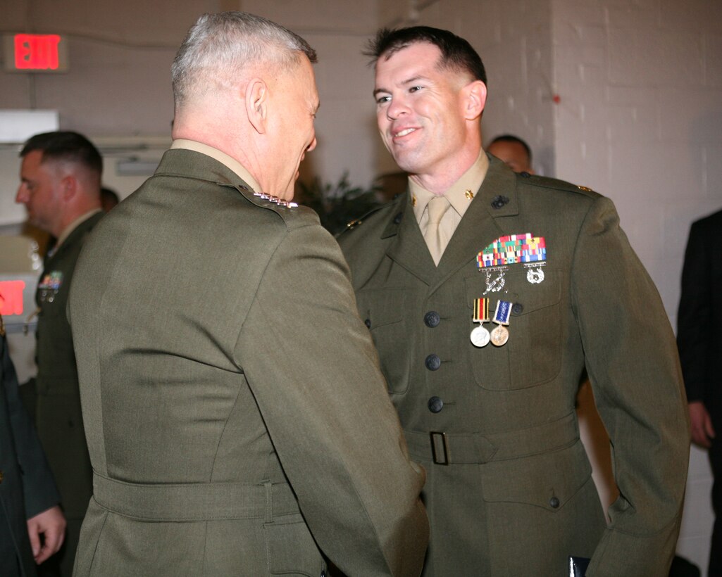 Marine Gen. John Paxton, Assistant Commandant of the Marine Corps, congratulates Maj. Matthew O'Donnell, officer-in-charge, Georgia Liaison Team, for being recognized with the General Giorgi Mazniashvili Medal and the Republic of Georgia’s Peacekeeping Operations Medal during an award ceremony aboard Joint Expeditionary Base Little Creek – Fort Story in Virginia Beach, Va., Feb. 28. The General Giorgi Mazniashvili Medal is the fourth highest individual award in the Georgian Armed Forces and it honors a servicemember’s leadership and contributions to Georgian national defense.