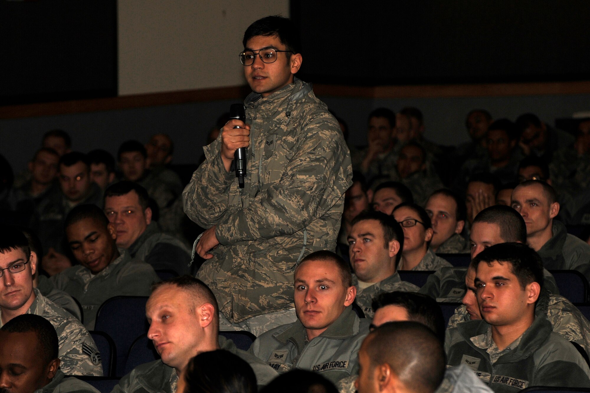 An Airman from Kunsan Air Base, asks Chief Master Sgt. Scott Delveau, 7th Air Force command chief, questions pertaining to the Wolf Pack mission with potential cuts to funding at Kunsan Air Base, Republic of Korea, Feb. 27, 2013. Delveau said leadership will disseminate sequestration facts as they become available. (U.S. Air Force photo by Senior Airman Marcus Morris)