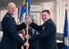 Lt. Col. J. Scot Heathman (right) assumes command of the 64th Air Refueling Squadron and  receives the unit's guidon from Col. Thomas J. Riney, 22nd Operations Group Commander, Pease Air National Guard Base, N.H., February 28, 2013.  (National Guard photo by Walter Santos/Released)