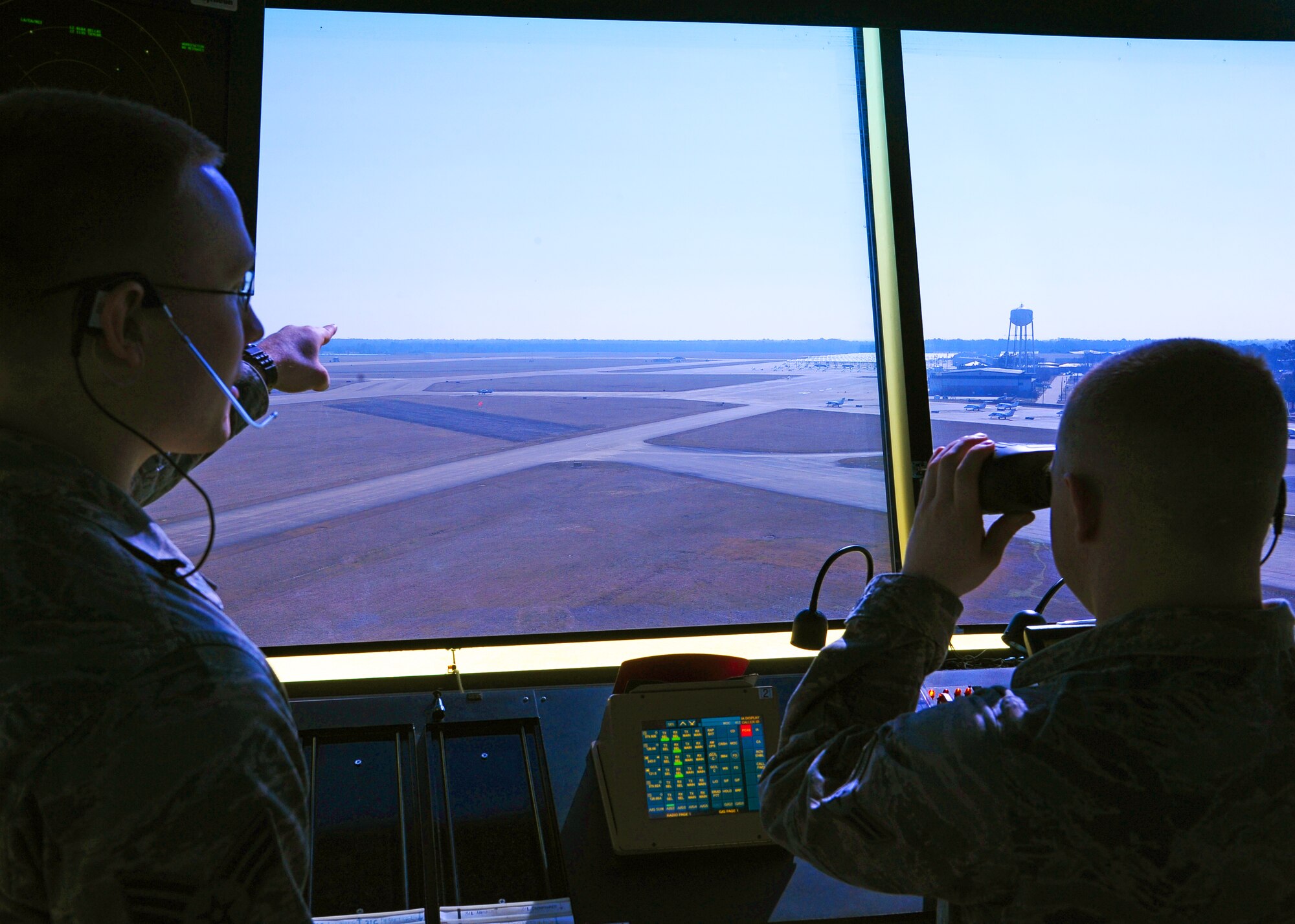 Senior Airman Jared Perkins and Airman 1st Class Christopher Coover, 14th Operations Support Squadron Air Traffic Controllers observe the Columbus AFB airfield Feb. 27. Columbus AFB was named the busiest Air Traffic Control facility in the Air Force at a total 377,835 air traffic movements. (U.S. Air Force photo/Senior Airman Chase Hedrick)