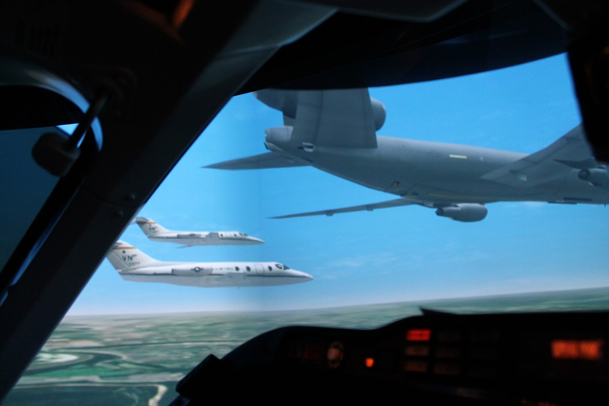 A T-1 simulator pilot participates in the first networked T-1 simulator sorties at Columbus AFB Feb. 1.  During this networked simulator mission, two separate T-1 simulators can see and communicate with each other during the flight.  (U.S. Air Force Photo)