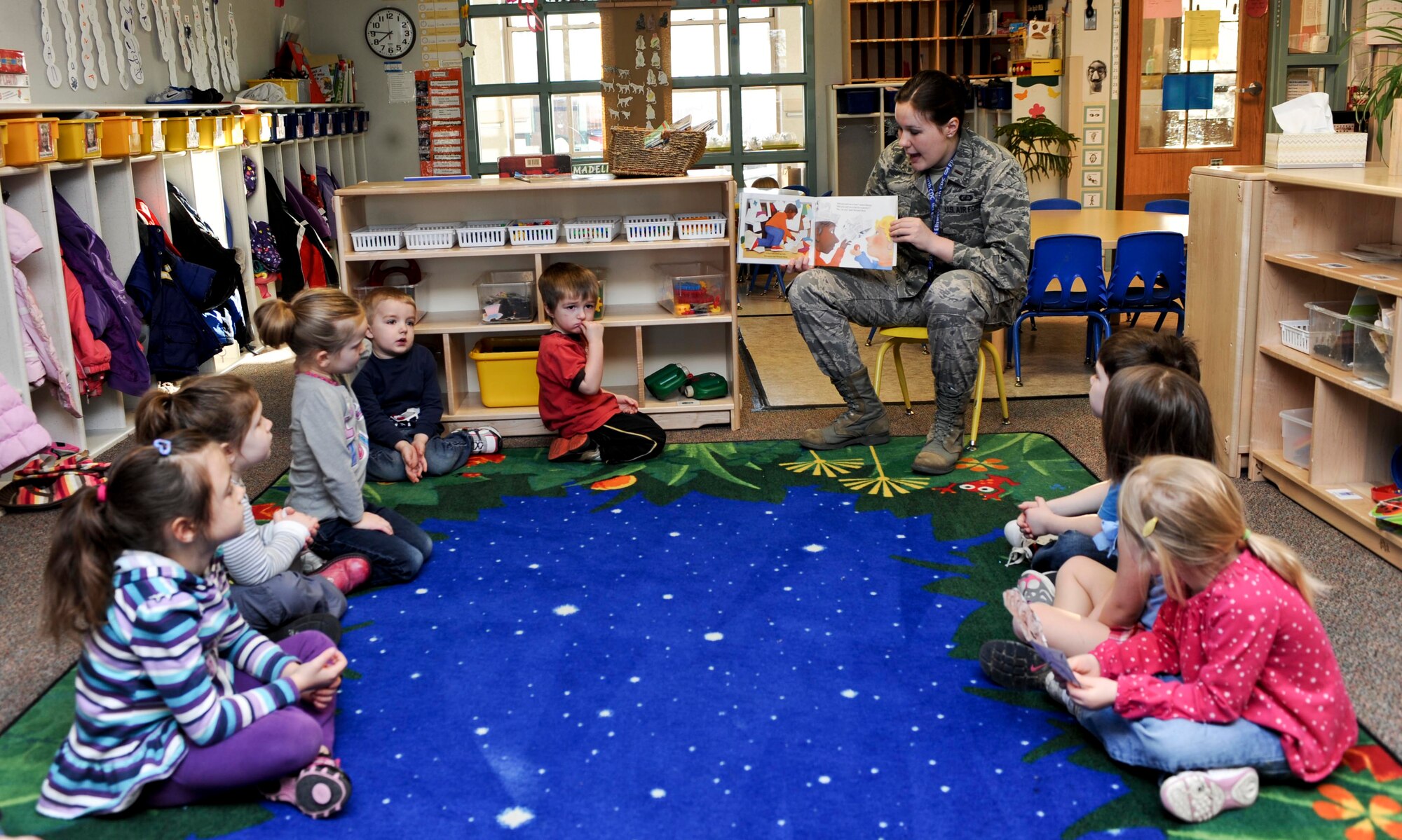Second Lt. Kara Noble, 28th Comptroller Squadron deputy flight financial analysis commander, reads to children enrolled in the base Child Development Center during Military Saves Week at Ellsworth Air Force Base, S.D., Feb. 25, 2013. In support of Military Saves Week, a nationally recognized time designed to raise awareness of financial issues for military members and their families, Noble visited three different classes to read, “Benny’s Pennies,” a children’s book about saving money . (U.S. Air Force photo by Airman 1st Class Anania Tekurio/Released)