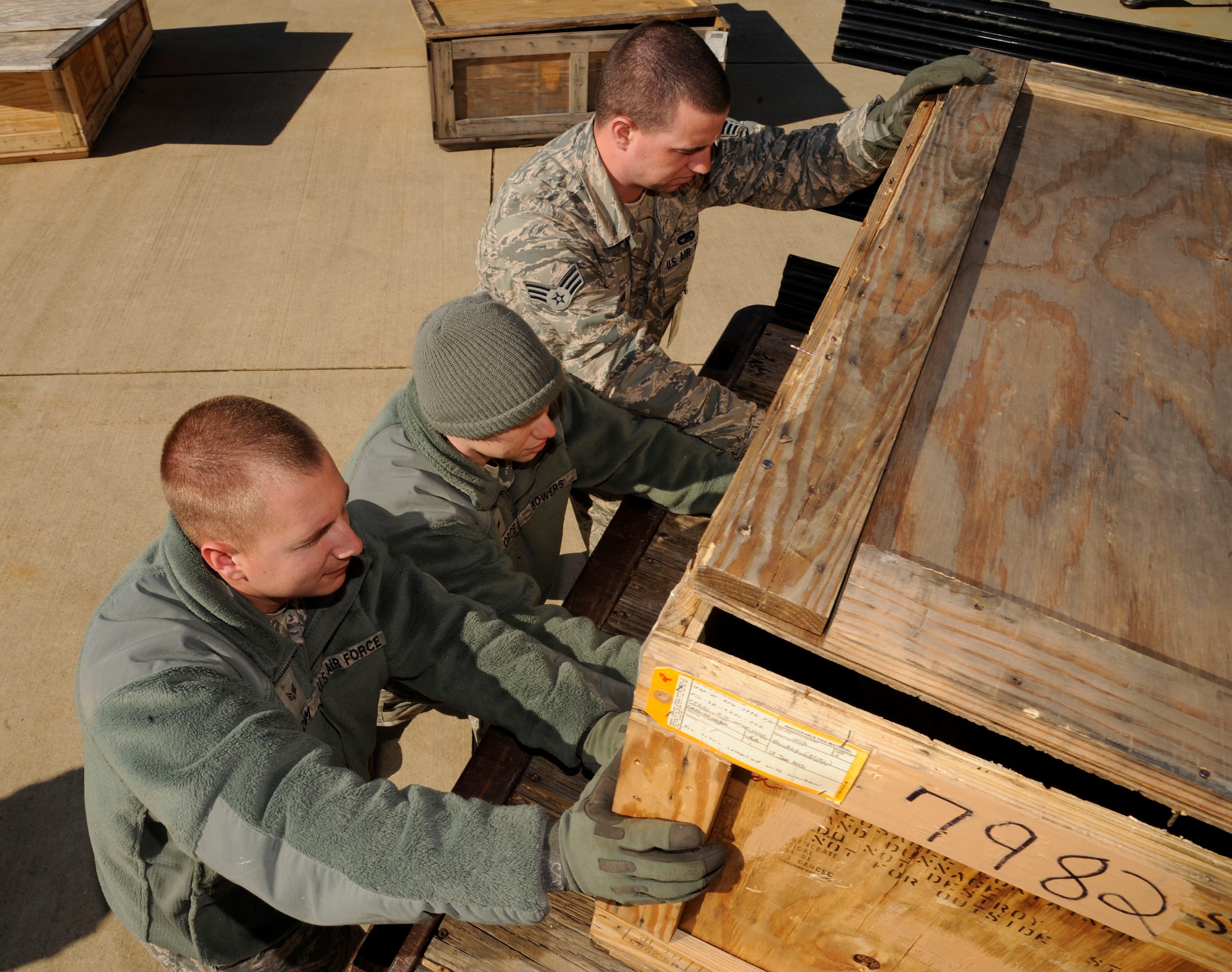 Senior Airmen Richard Cram, Jesse Bowers and Jeff Dean, 2nd Logistics Readiness Squadron, load a crate of B-52H Stratofortress engine cowlings on Barksdale Air Force Base, La., Feb. 28. The cowlings will be shipped to Tinker Air Force Base, Okla., for depot level repairs. Depot level repairs are where components or aircraft parts require higher level maintenance and need more advanced equipment to help assess problems. (U.S. Air Force photo/Airman 1st Class Andrew Moua)