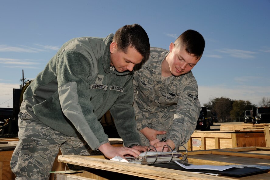 Staff Sgt. Alejandro Fernandez, 2nd Maintenance Squadron, and Airman 1st Class Frederick Ross, 2nd Logistics Readiness Squadron, look through a checklist before loading B-52H Stratofortress cowlings onto trucks for shipment on Barksdale Air Force Base, La., Feb. 28. The cowlings were sent to depot at Tinker Air Force Base, Okla., for repairs. Depot is where components or aircraft parts require higher level maintenance and need more advanced equipment to help assess problems (U.S. Air Force photo/Airman 1st Class Andrew Moua)