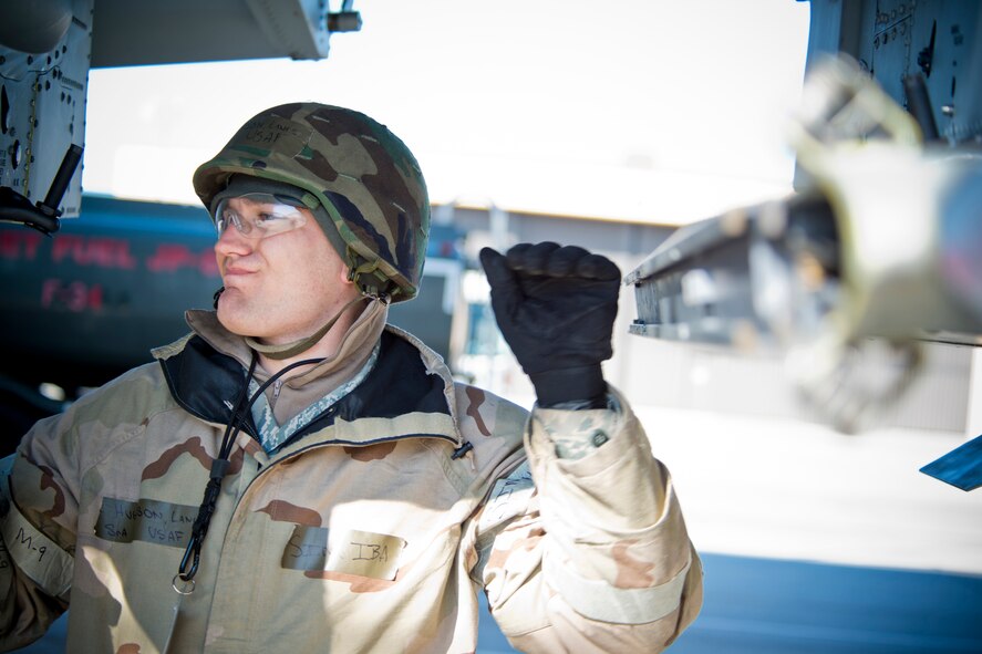 U.S. Air Force Senior Airman Lance Hughson, 23d Maintenance Operations Squadron lead crew member, performs a pre-load inspection of an A-10C Thunderbolt II during a phase II operational readiness exercise Feb. 28, 2013, at Moody Air Force Base, Ga. Hughson, with teamwork from weapons load crew members and crew chiefs, ensured aircraft were properly maintained and ready to continue missions throughout the exercise. (U.S. Air Force photo by Staff Sgt. Jamal D. Sutter/Released) 