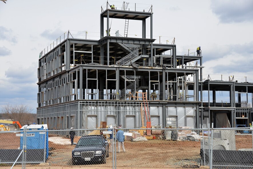 The last installed I-beam completes the shell of the new 175th Wing Headquarters, Mission Support Group and Medical Group facility at Warfield Air National Guard Base, Baltimore, Md. February 28, 2013. This new construction has a projected cost $11.8 million, and features multiple green roofs and is anticipated to achieve certified LEED Silver status with the numerous energy enhancement measures upon its completion. Functional areas include offices, medical/dental examination and treatment space, classrooms, administration space, command section, conference rooms, telephone switching/data automation center as well as utility systems services and connections. (National Guard photo by Senior Master Sgt. Ed Bard) 
