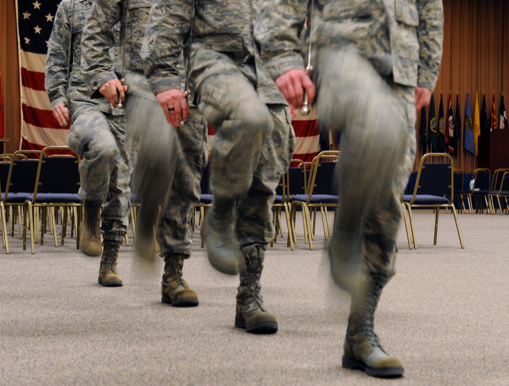Airmen from the Barksdale Honor Guard Alpha Flight march in place during a saber cordon practice on Barksdale Air Force Base, La., Feb. 28. Honor Guard Airmen perform during retirements, funerals and many other military-related events honoring service members both past and present. (U.S. Air Force photo/Airman 1st Class Benjamin Gonsier)