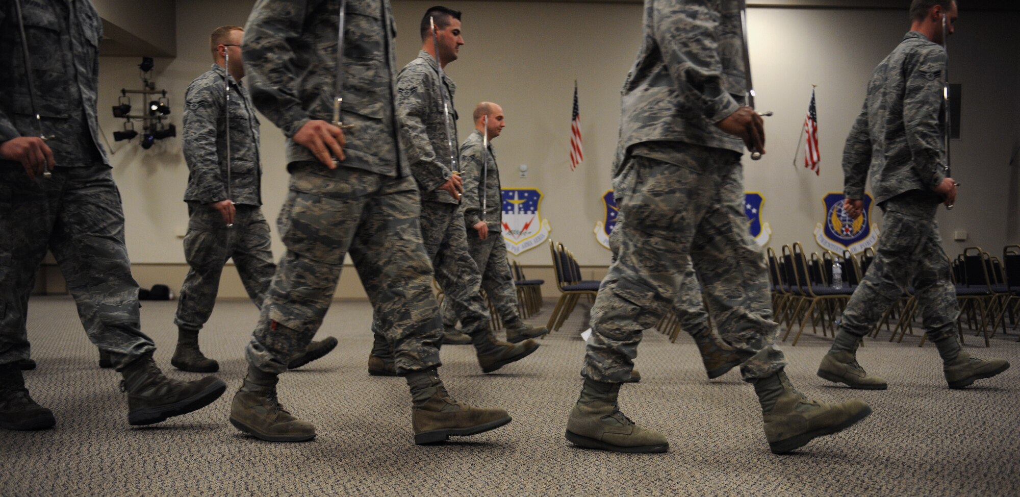 Airmen from the Barksdale Honor Guard Alpha Flight march during a saber cordon practice on Barksdale Air Force Base, La., Feb. 28. Airmen from Alpha Flight were preparing for the upcoming monthly promotion ceremony. (U.S. Air Force photo/Airman 1st Class Benjamin Gonsier)