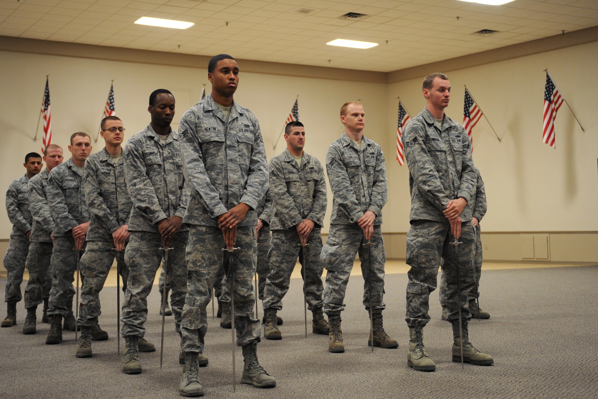 Airmen from the Barksdale Honor Guard Alpha Flight stand at ease during saber cordon practice on Barksdale Air Force Base, La., Feb. 28. Airmen from Alpha Flight were preparing for the upcoming monthly promotion ceremony. (U.S. Air Force photo/Airman 1st Class Benjamin Gonsier)