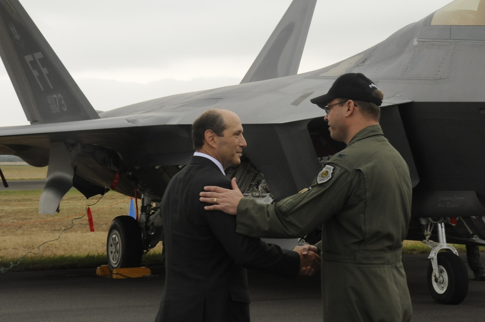 U.S. Air Force Col. Stephen Williams, Misawa Air Base, Japan, wing commander, shakes hands with Jeffrey Bleich, Australian ambassador, as Bleich departs the Australian International Airshow 2013 at Avalon, Australia, Feb. 27, 2013. This marks the second day of the AIA13 at the Avalon Airport. This event features 500 exhibitors from 35 countries and is designed to bolster business opportunities and international aviation sector. U.S. participation in the AIA13 directly supports theater engagements, goals and objectives and further enhances relationships with other Pacific nations. (U.S. Air Force photo by Airman 1st Class Kenna Jackson)