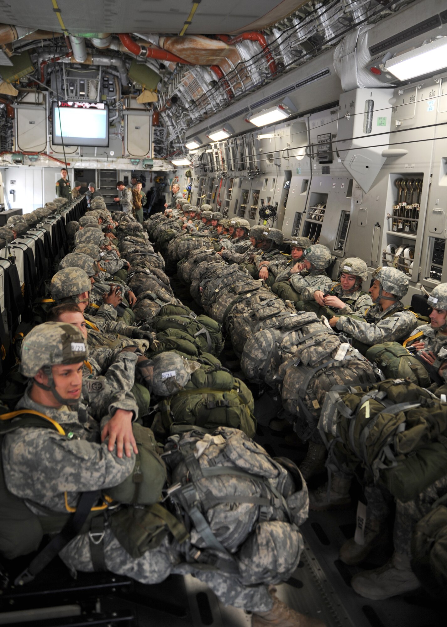 U.S. Army paratroopers sit aboard a U.S. Air Force C-17 Globemaster III to complete a static line air drop, Feb. 25, 2015, Fort Bragg, N.C. The Joint Operational Access Exercise (JOAX) 13-02 is a combined exercise to prepare elements of the 82nd Airborne Division, along with its partners and enablers to respond as part of the Global Response Force (GRF). (U.S. Air Force photo by Senior Airman Jaclyn McDonald)