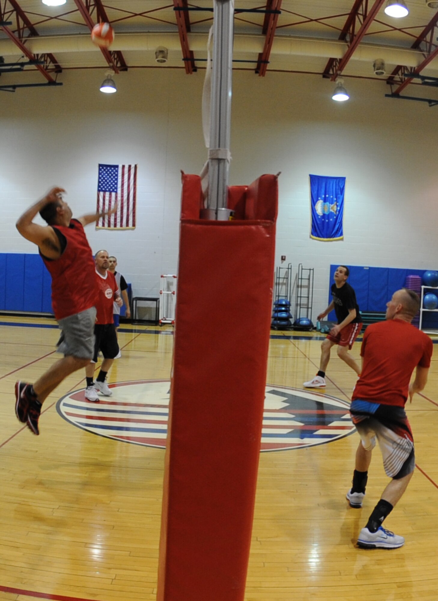 WHITEMAN AIR FORCE BASE, Mo. – Orlando Diaz, Civil Engineer-A team member, goes up for a spike against the Operations Support Squadron, Feb. 25. CE-A would win the second set 25-11 on their way to a 2-0 match victory. (U.S. Air Force photo Airman 1st Class Bryan Crane)(Released)