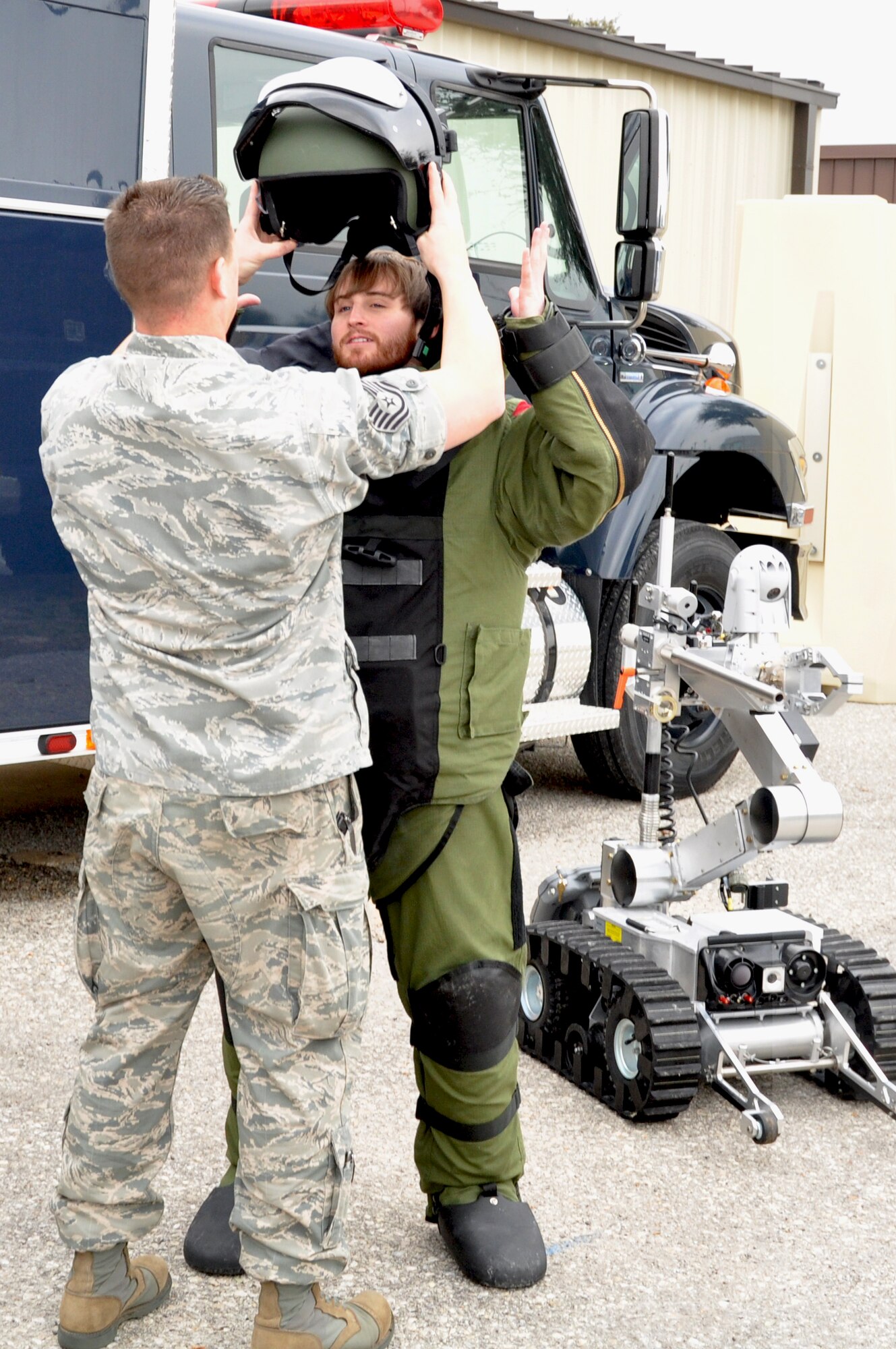 Missouri Science and Technology University students paid a visit to the 301st Fighter Wing's EOD section recently for some hands on EOD experience. The students were given the opportunity to see how the explosive ordinance equipment saves lives and how the gear is worn to protect the Airmen. Tech. Sgt. Andrew Lebeau, 301st Civil Engineer Squadron, helps to suit up one of the students. The EOD team is new to the 301st Civil Engineer Squadron at the Naval Air Station Fort Worth Joint Reserve Base, Texas.