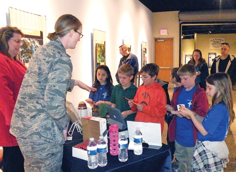 The Air Force Research Laboratory's Space Vehicles and Directed Energy Directorates volunteered in assisting with the “Discover STEM” week Feb. 11-15 at the National Museum of Nuclear Science and History in Albuquerque. Presenters talked to students about their careers in science, engineering, technology and mathematics, and what motivated them to become scientists. 

Diana Loree and Capt. Katrina Schweiker show and demonstrate laser and high-power microwave technologies to local students. High-power microwaves counter-electronics protect assets and deter aggressors with non-lethal technology. Lasers enable precision accuracy with long-range strike capabilities at the speed of light. 