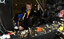 MINOT AIR FORCE BASE, N.D. -- A STARBASE North Dakota student has the opportunity to be in the seat of a UH-1N Huey here as part of the program's tour of the 54th Helicopter Squadron. Several agencies at Minot Air Force Base have teamed with STARBASE to give their students the opportunity to see real-world involvement of professionals in science, technology, engineer and math (STEM) related career fields. (U.S. Air Force photo/Senior Airman Brittany Y. Auld)