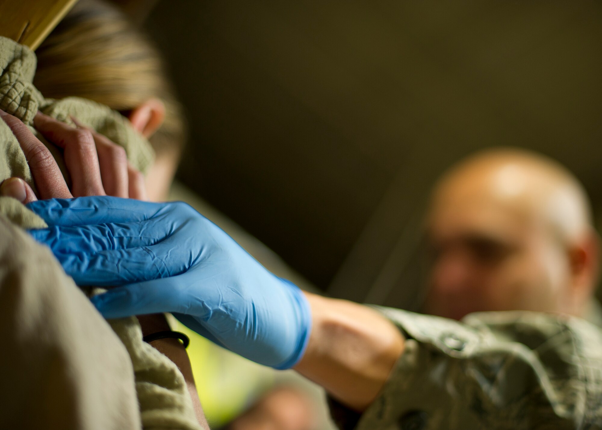 EXERCISE, EXERCISE, EXERCISE – A medic applies pressure to a simulated shooting victim’s wound at Bldg 811 at Holloman Air Force Base, N.M., Feb 26. The active shooter exercise tested the threat response time and effectiveness of Holloman AFB. Emergency medical personnel arrived on the scene after the threat was cleared to treat the casualties. (U.S. Air Force photo by Senior Airman DeAndre Curtiss / Released)