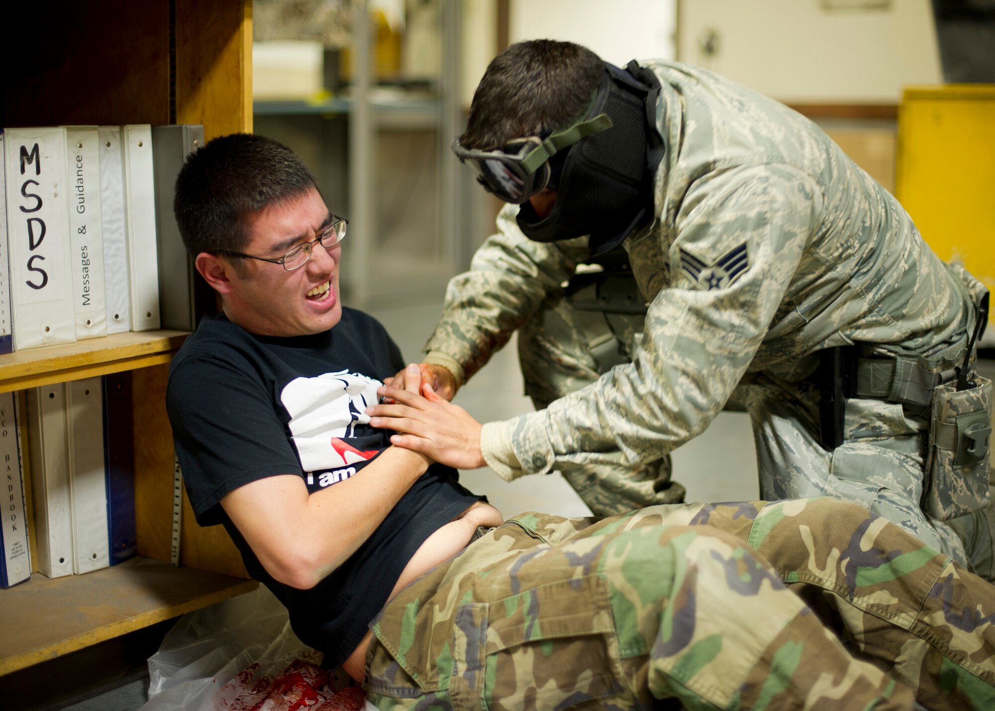 EXERCISE, EXERCISE, EXERCISE – A responder prepares a simulated casualty for emergency medical treatment during an active shooter exercise at Holloman Air Force Base, N.M., Feb. 26. The active shooter exercise tested the threat response time and effectiveness of Holloman AFB’s first responders. The 49th Security Forces Squadron members secondary mission was tending to the simulated casualties until emergency medical personnel arrived. (U.S. Air Force photo by Senior Airman DeAndre Curtiss / Released)