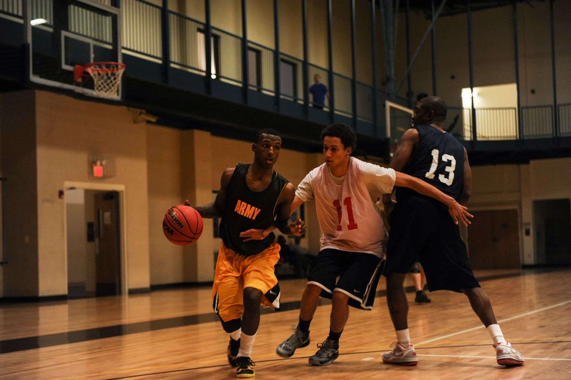 John Dismuke, point guard for Army intramural basketball team black, drives to the paint Feb. 26, 2013, at Little Rock Air Force Base, Ark. The black team, who led for most of the first half, lost 77-67. (U.S. Air Force photo by Airman 1st Class Cliffton Dolezal)