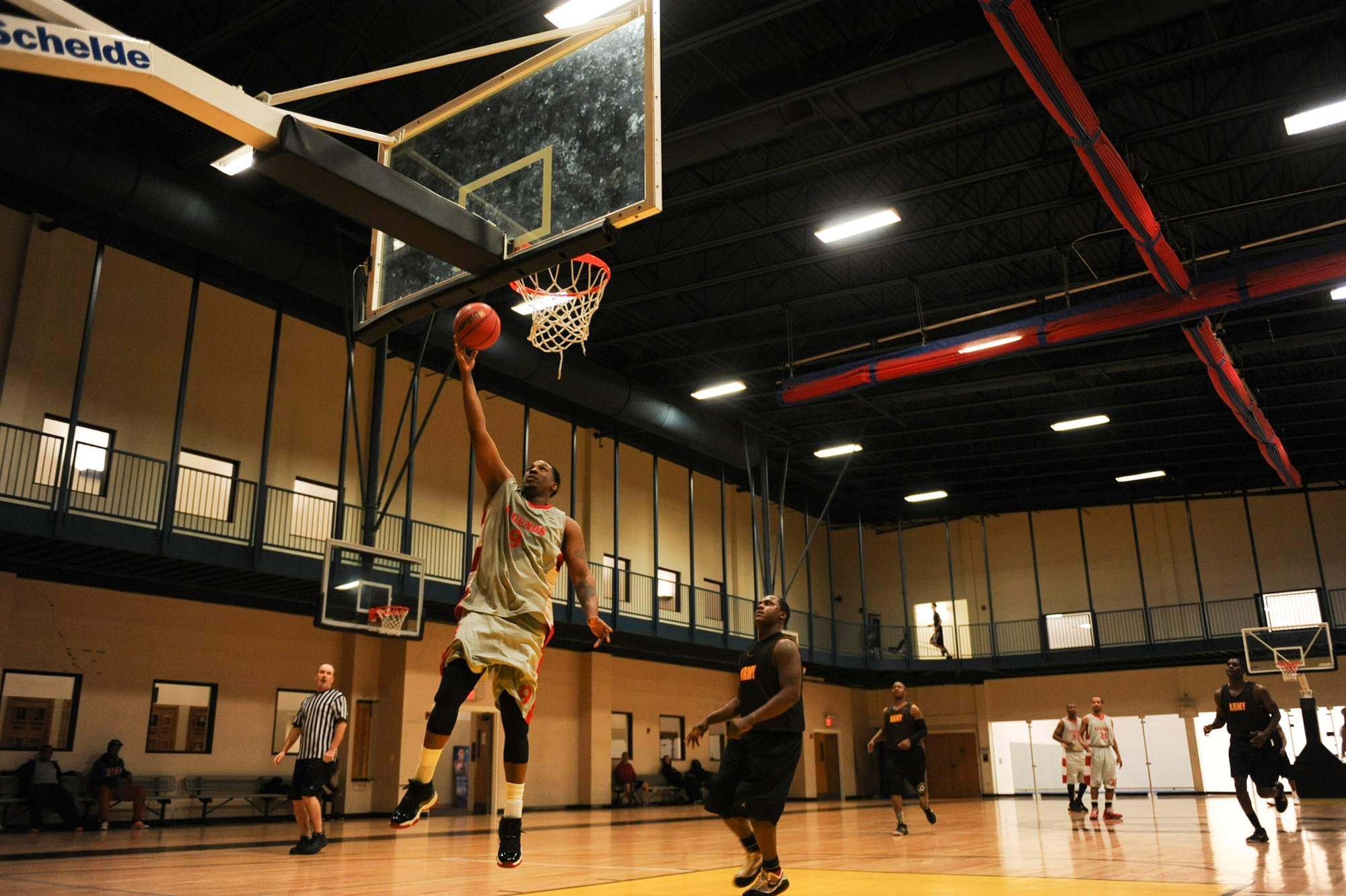 Ashley Champion, small forward for Army intramural basketball team gray, shoots a layup Feb. 26, 2013, at Little Rock Air Force Base, Ark. The final score was 77-67. (U.S. Air Force photo by Airman 1st Class Cliffton Dolezal)