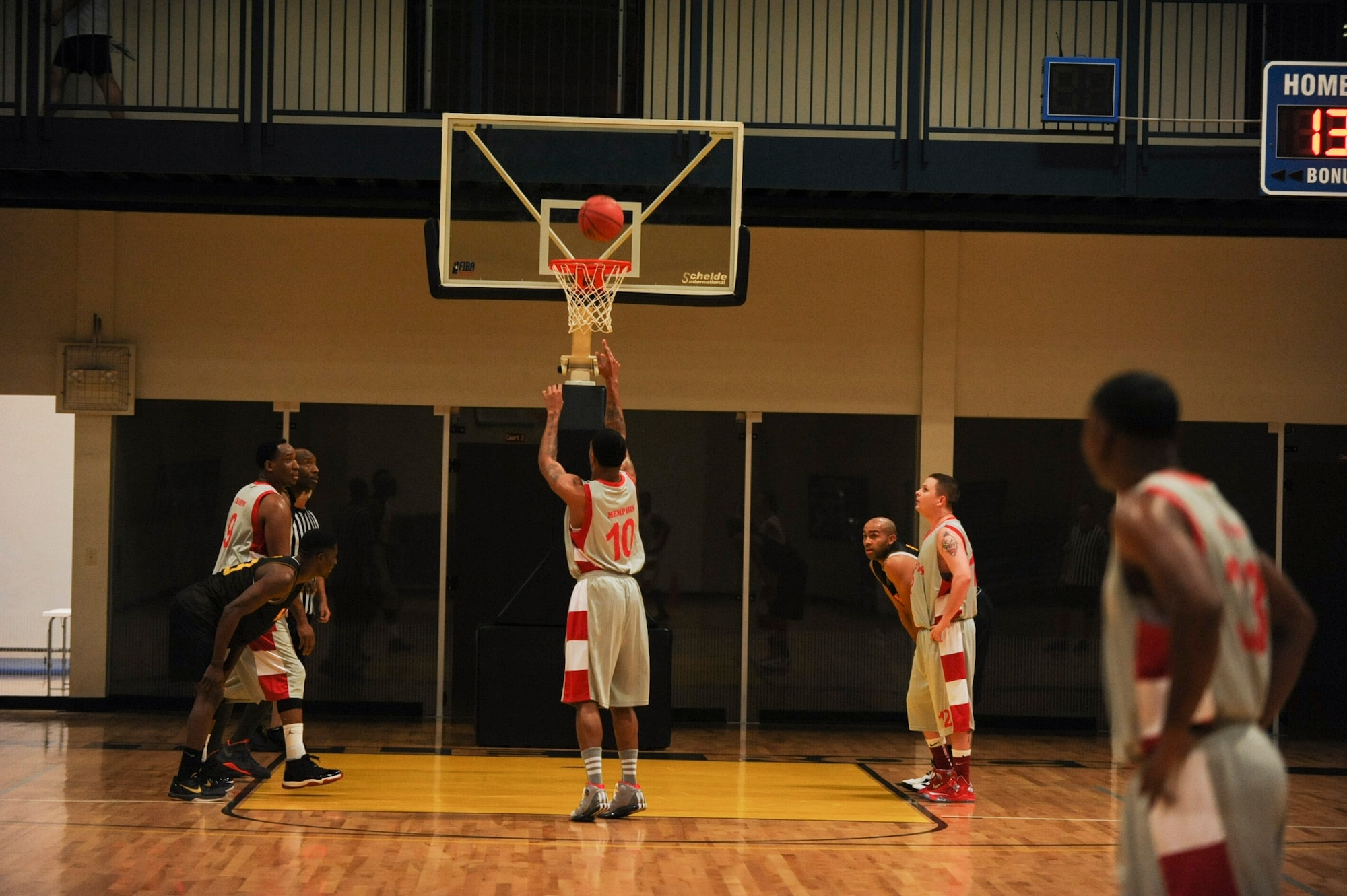 Courtney Thomas, center for the Army intramural basketball team gray, attempts a free throw early in the first half Feb. 26, 2013, at Little Rock Air Force Base, Ark. Thomas’ team pulled away in the second half and won 77-67. (U.S. Air Force photo by Airman 1st Class Cliffton Dolezal)