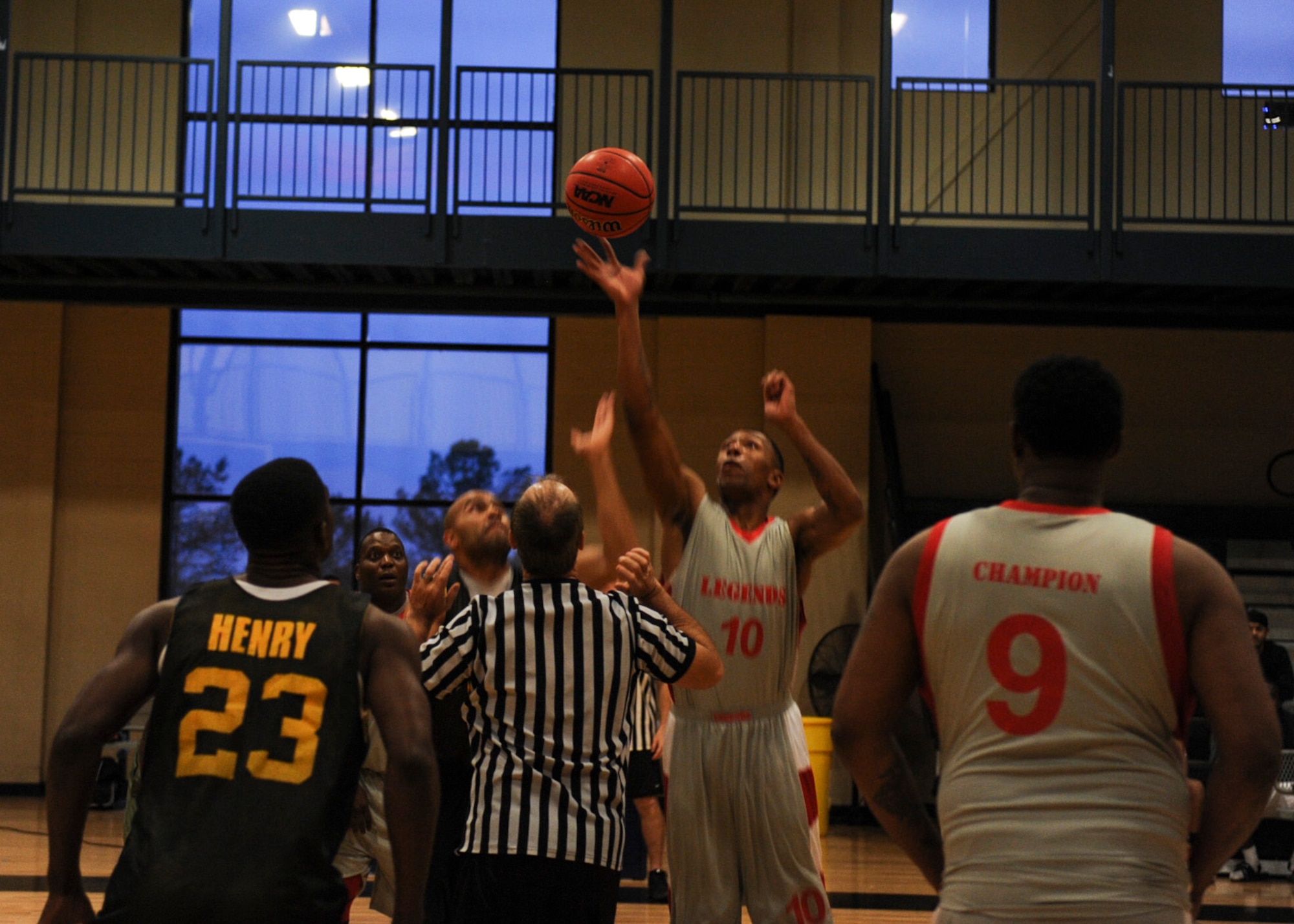 Courtney Thomas, center for the Army intramural basketball team gray, wins the tip off to start the game Feb. 26, 2013, at Little Rock Air Force Base,Ark. Thomas’ team would later go on to win the game 77-67. (U.S. Air Force photo by Airman 1st Class Cliffton Dolezal)